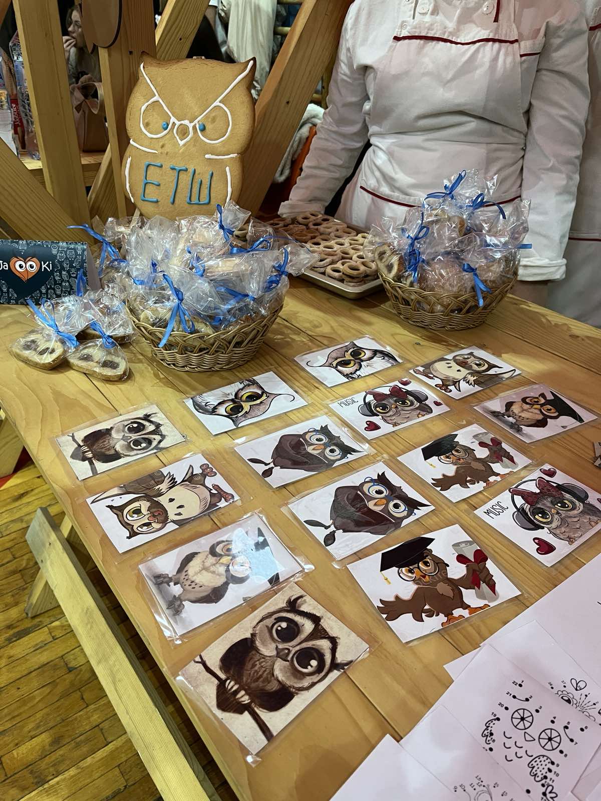 A table with pictures and cookies

Description automatically generated